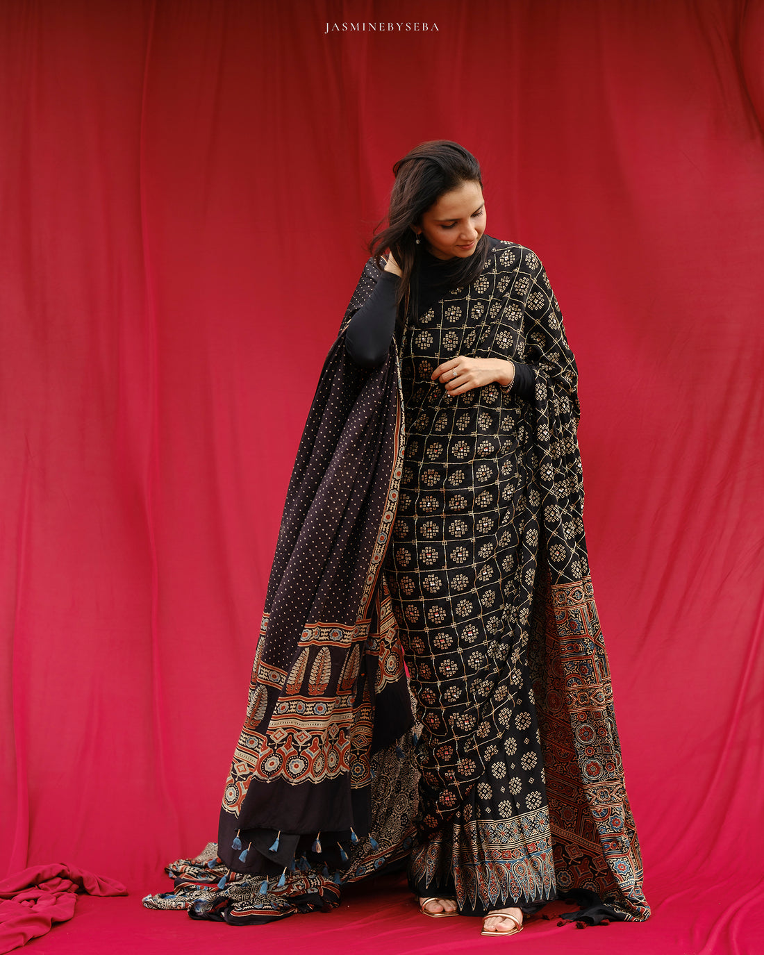 Ajrakh modal silk hand dyed, hand block printed and handworked saree