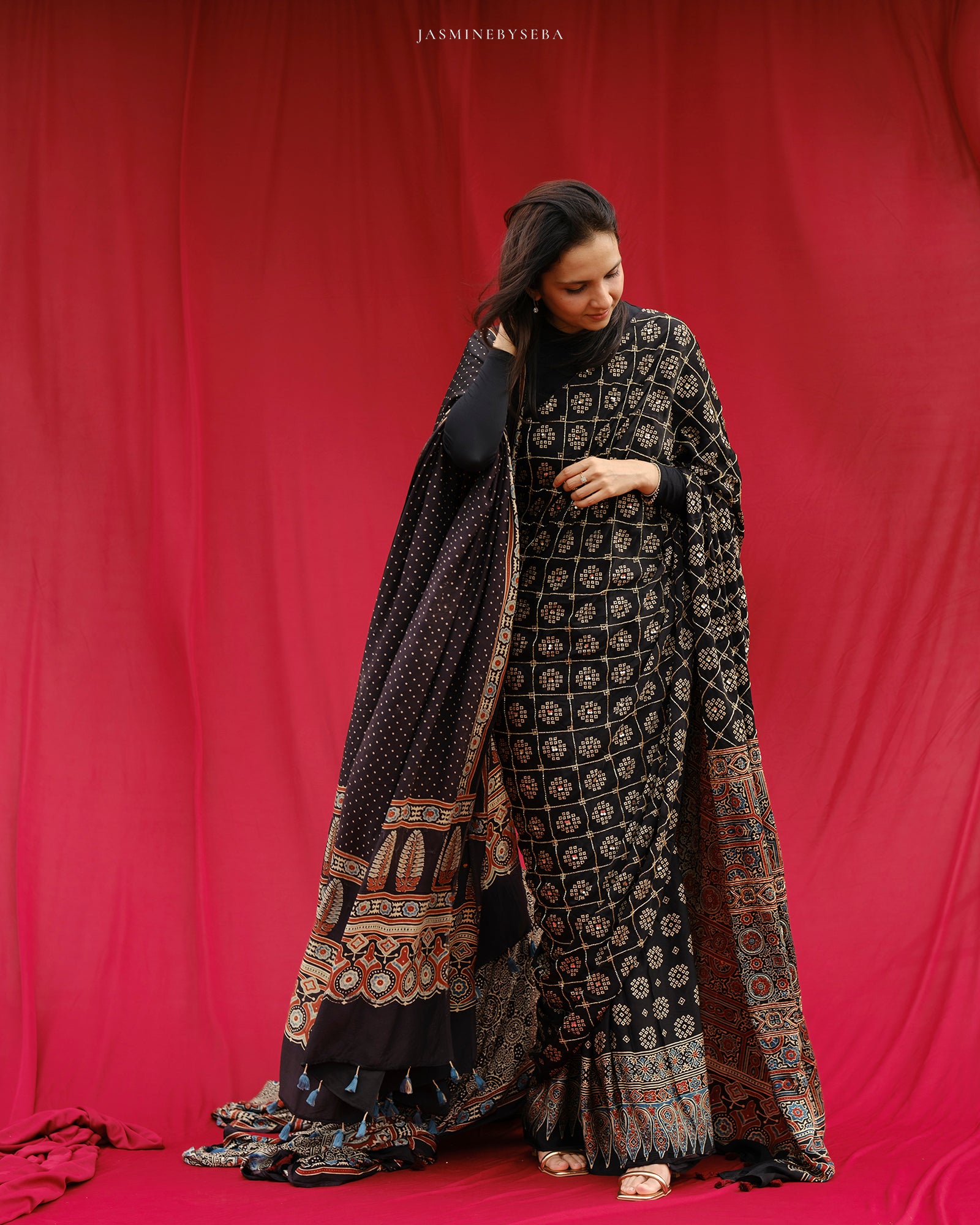 Ajrakh modal silk hand dyed, hand block printed and handworked saree