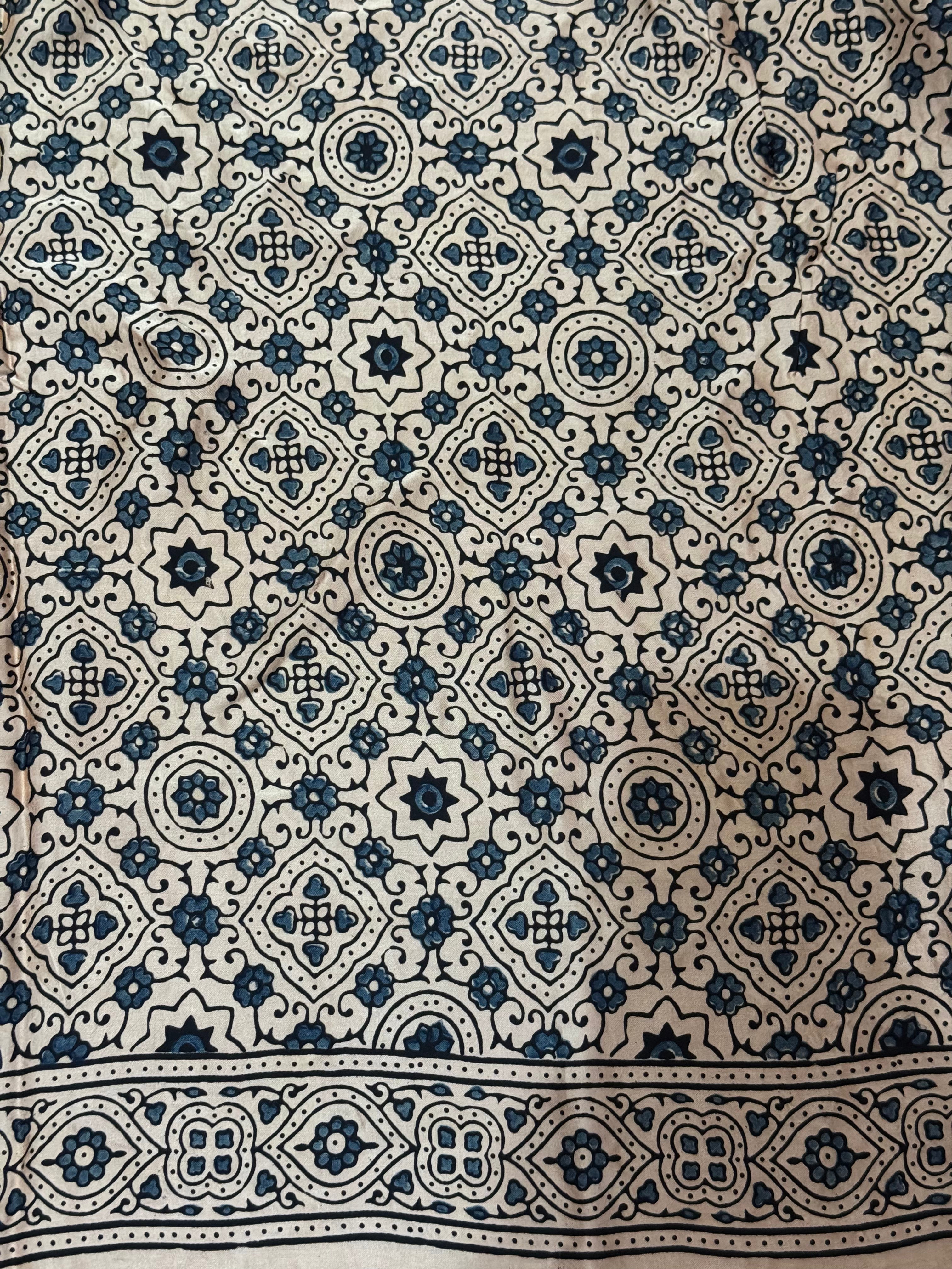 Ajrakh modal silk hand dyed, hand block printed and handworked saree