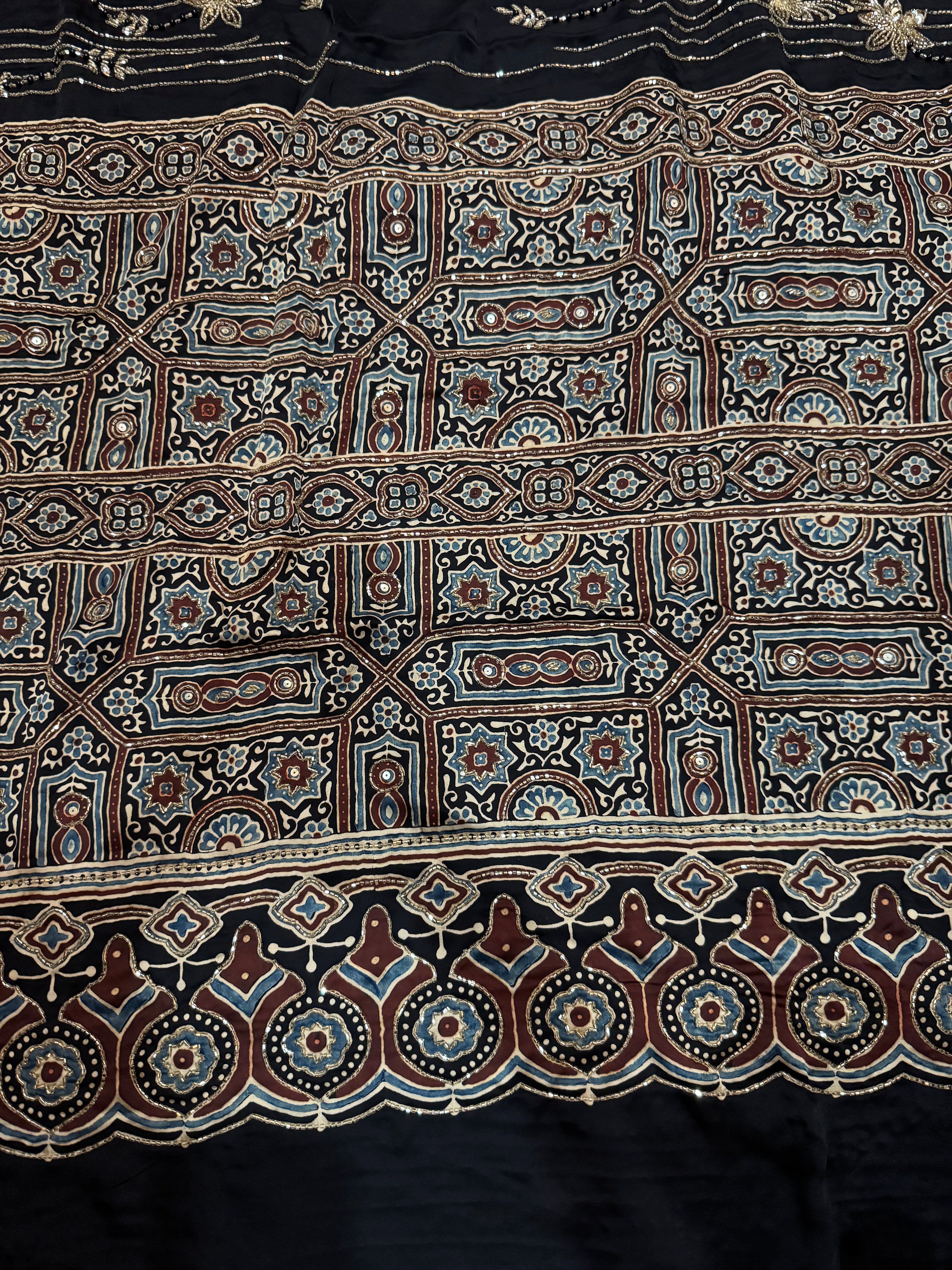 Ajrakh pure modal silk hand dyed, hand block printed and handworked saree