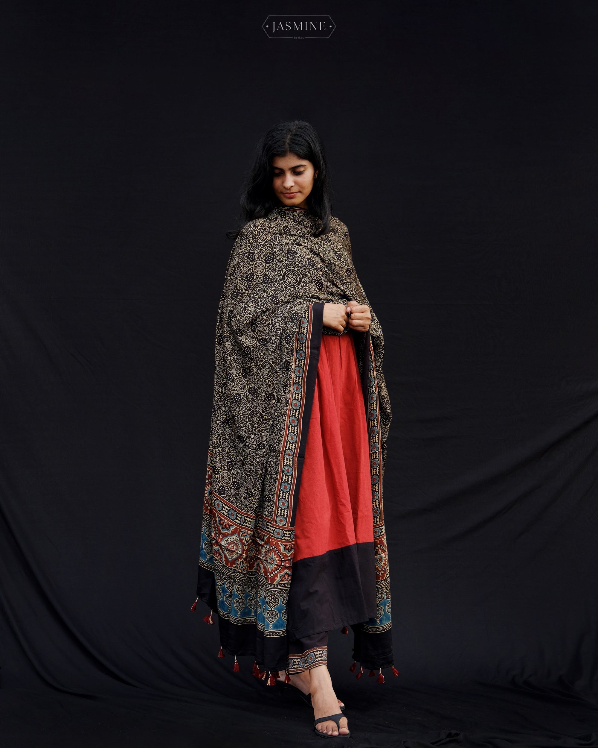 Ajrakh cotton pleated top and pants with modal silk dupatta.