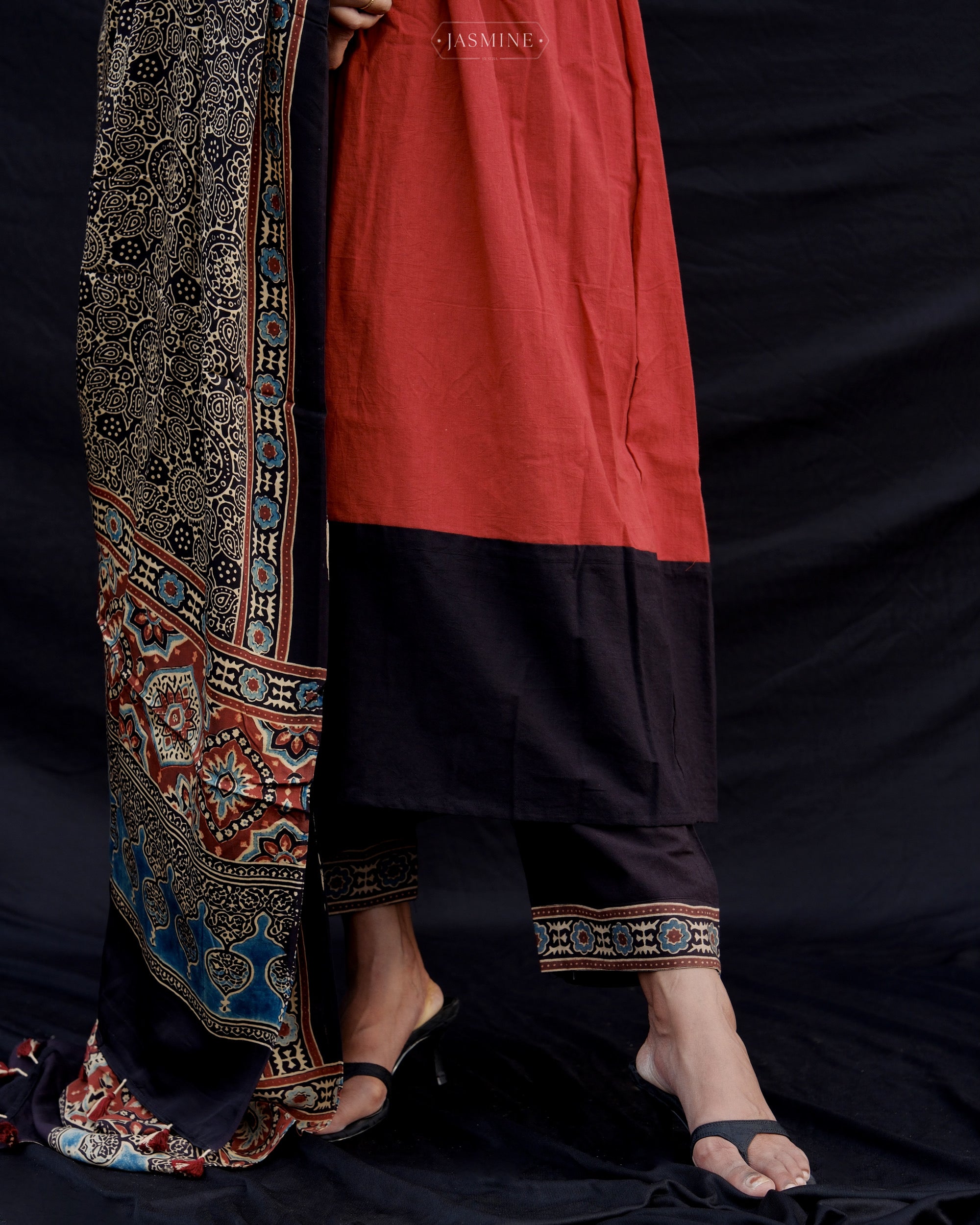 Ajrakh cotton pleated top and pants with modal silk dupatta.