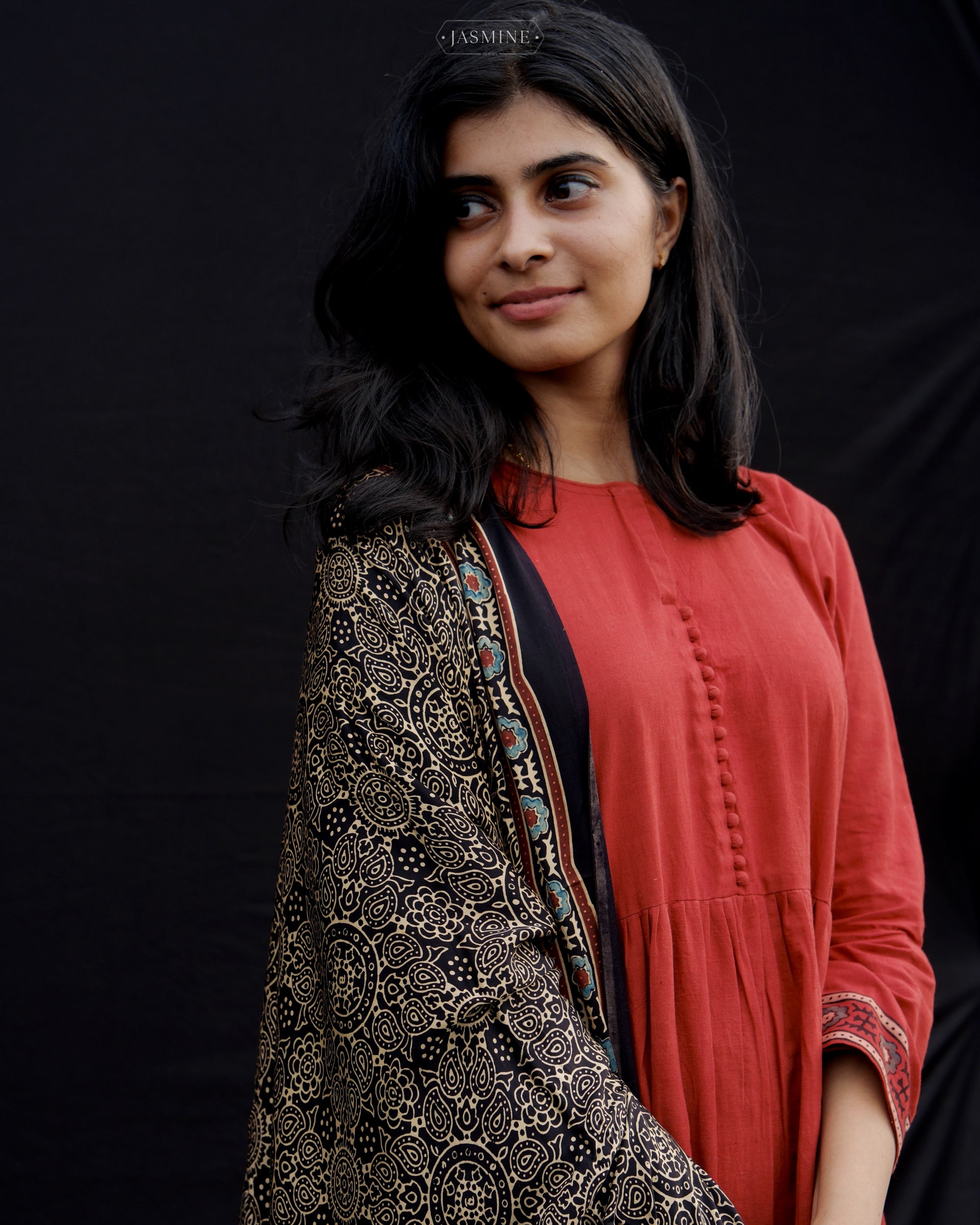 Ajrakh cotton pleated top and pants with modal silk dupatta.