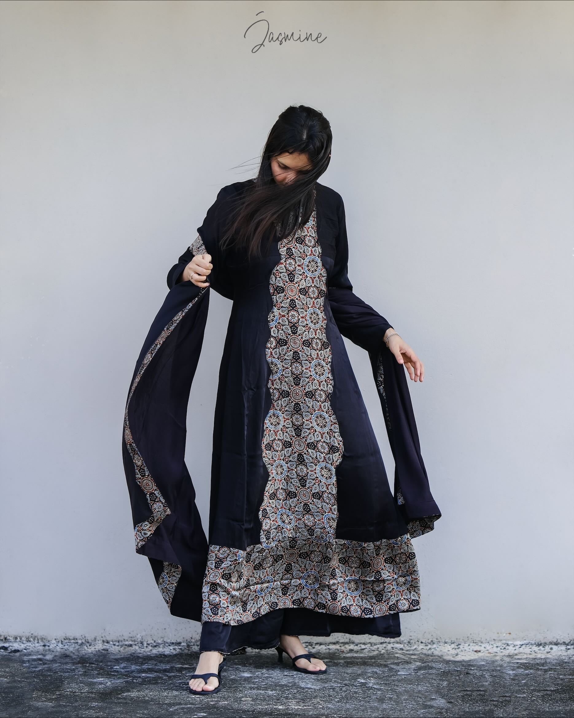 Ajrakh modal silk panel cut dress with printed modal silk patchwork teamed with
panel cut wide pants.