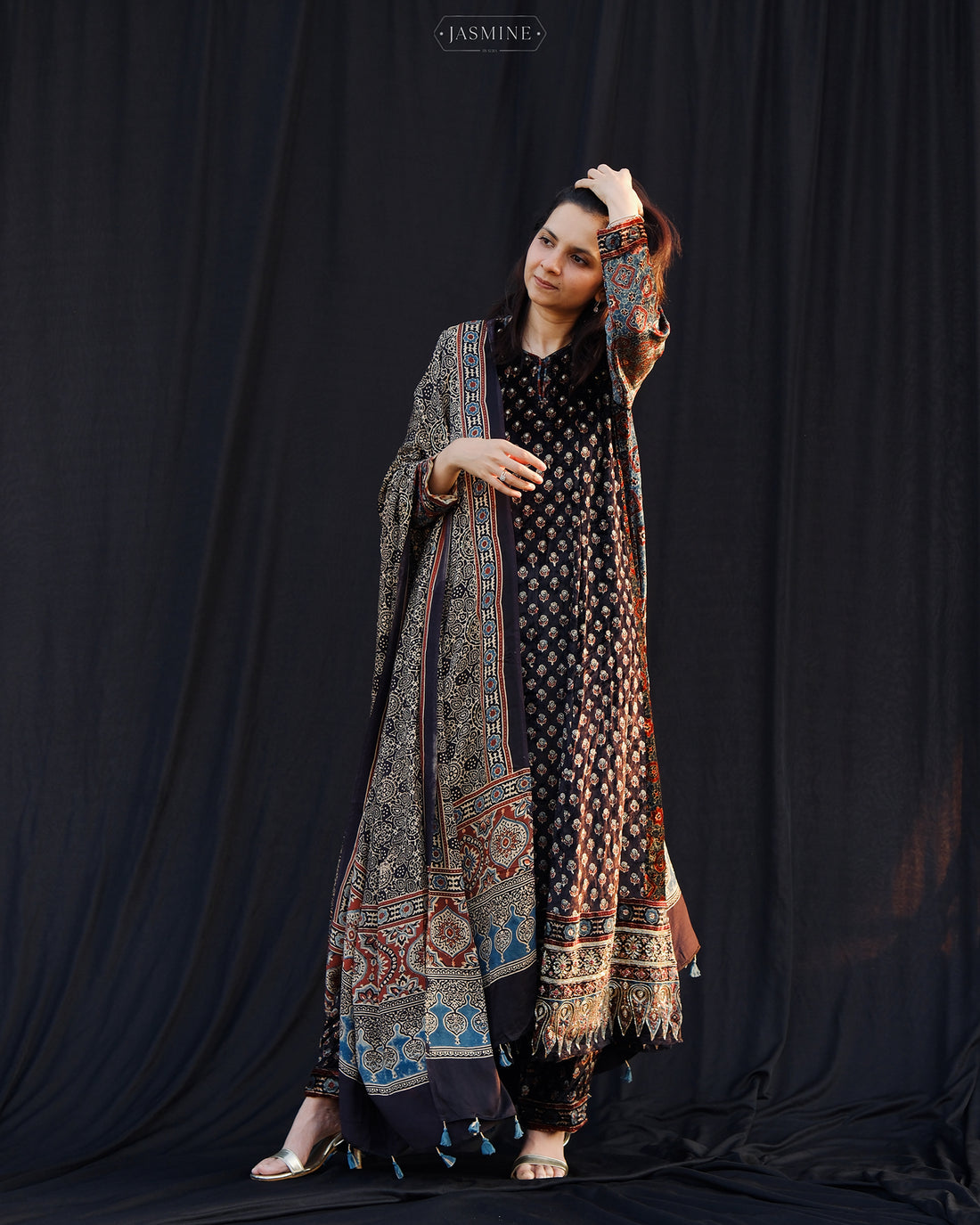 Ajrakh hand block printed velvet silk panel line salwar set with cutbead handwork