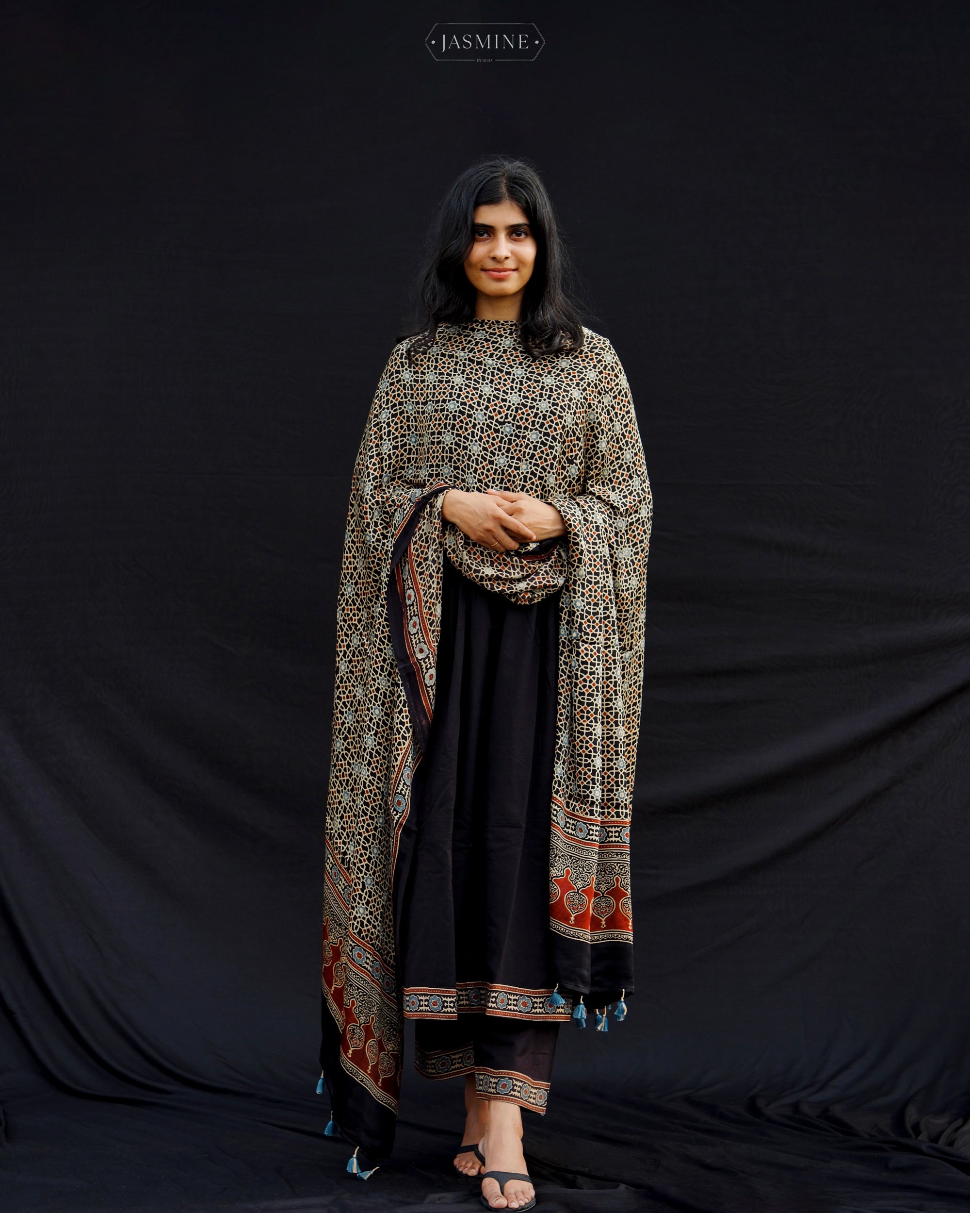 Cotton Ajrakh pleated set with modal silk dupatta.