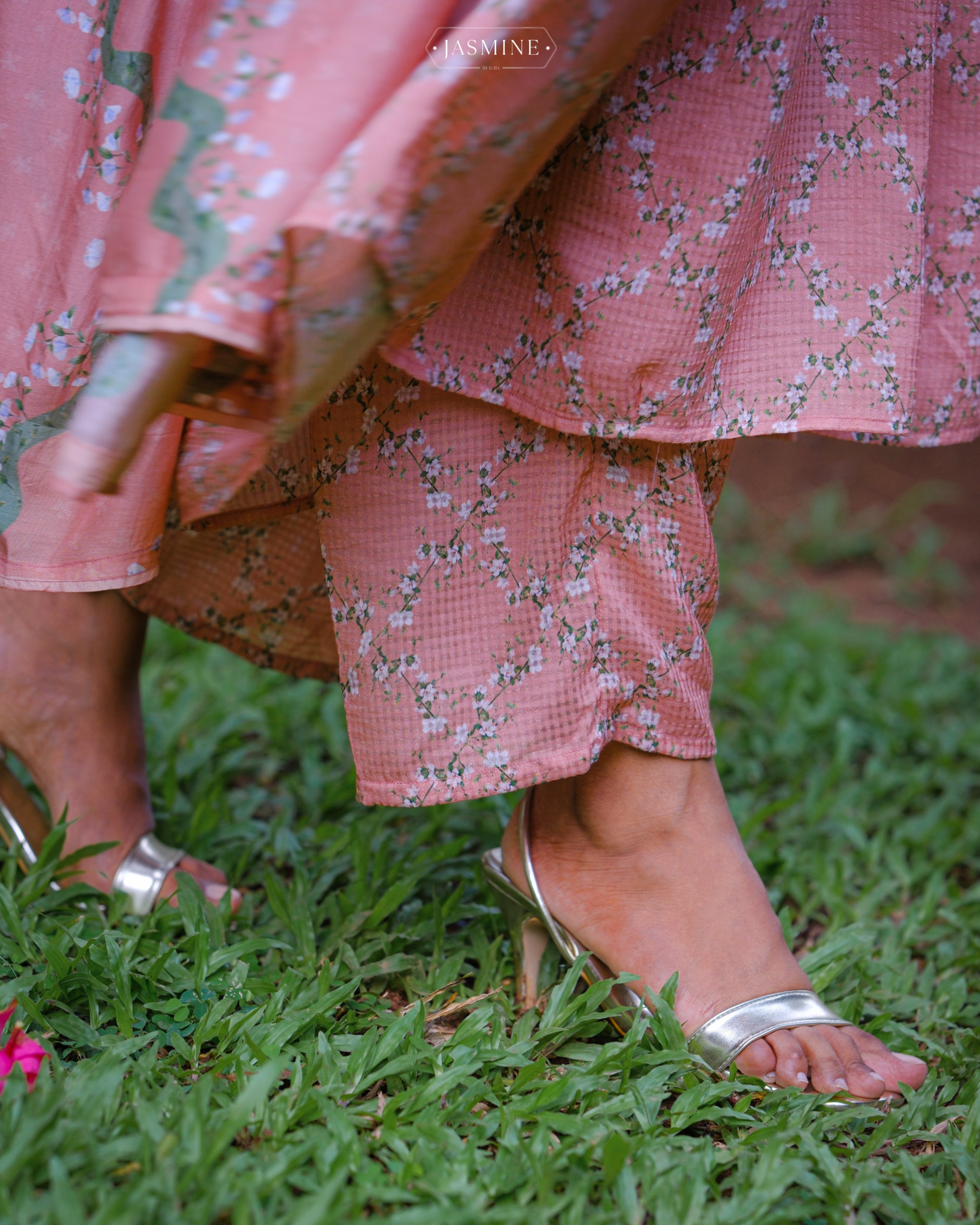 In-house printed Jasmine prints on coral shaded pleated kurta set in viscose voile