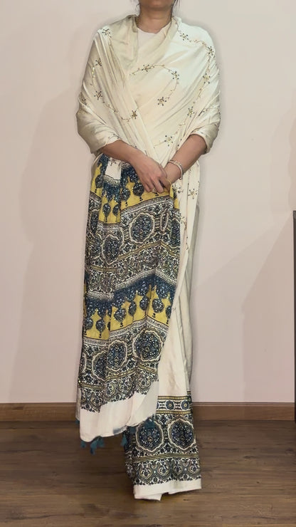 Ajrakh modal silk hand dyed, hand block printed and handworked saree